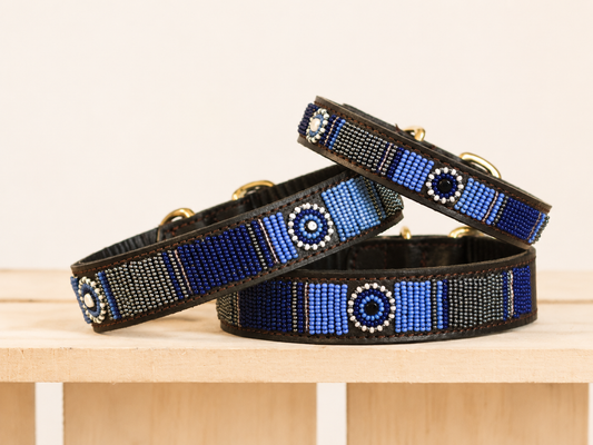 GEORGIA beaded dog collars in shades of blue on a light wooden crate