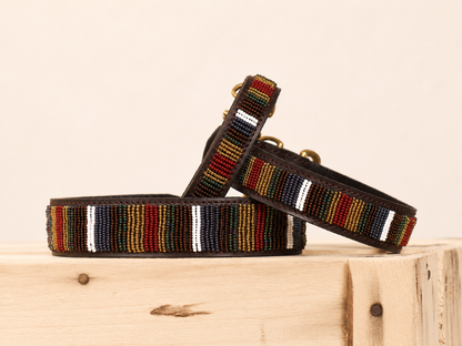 HAVANA beaded leather dog collar with dark multicolour Maasai stripes on wooden crate