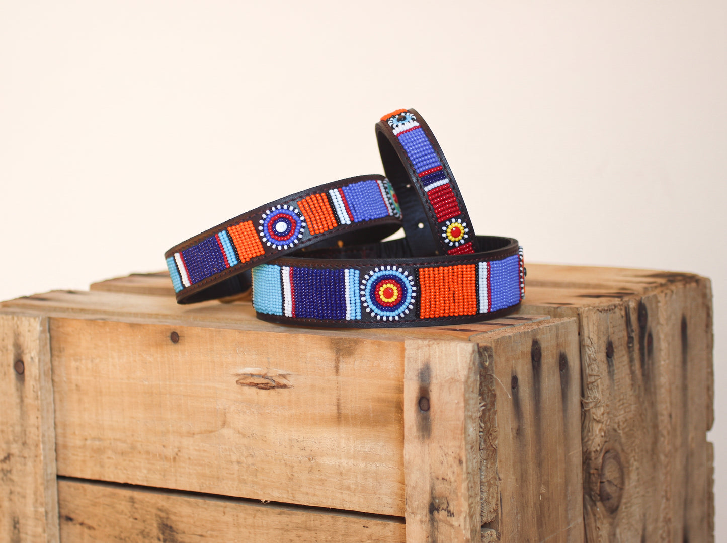 MACHU PICCHU beaded dog collar by COLLART on wooden crate